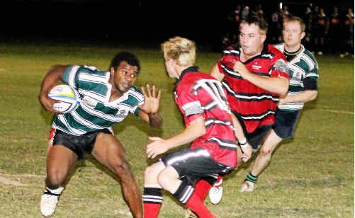 Bundaberg Turtle Jessy Tass takes it to Wests Barbarians Josh Ely and John Daniel. Bundaberg Turtle Jessy Tass takes it to Wests Barbarians Josh Ely and John Daniel.